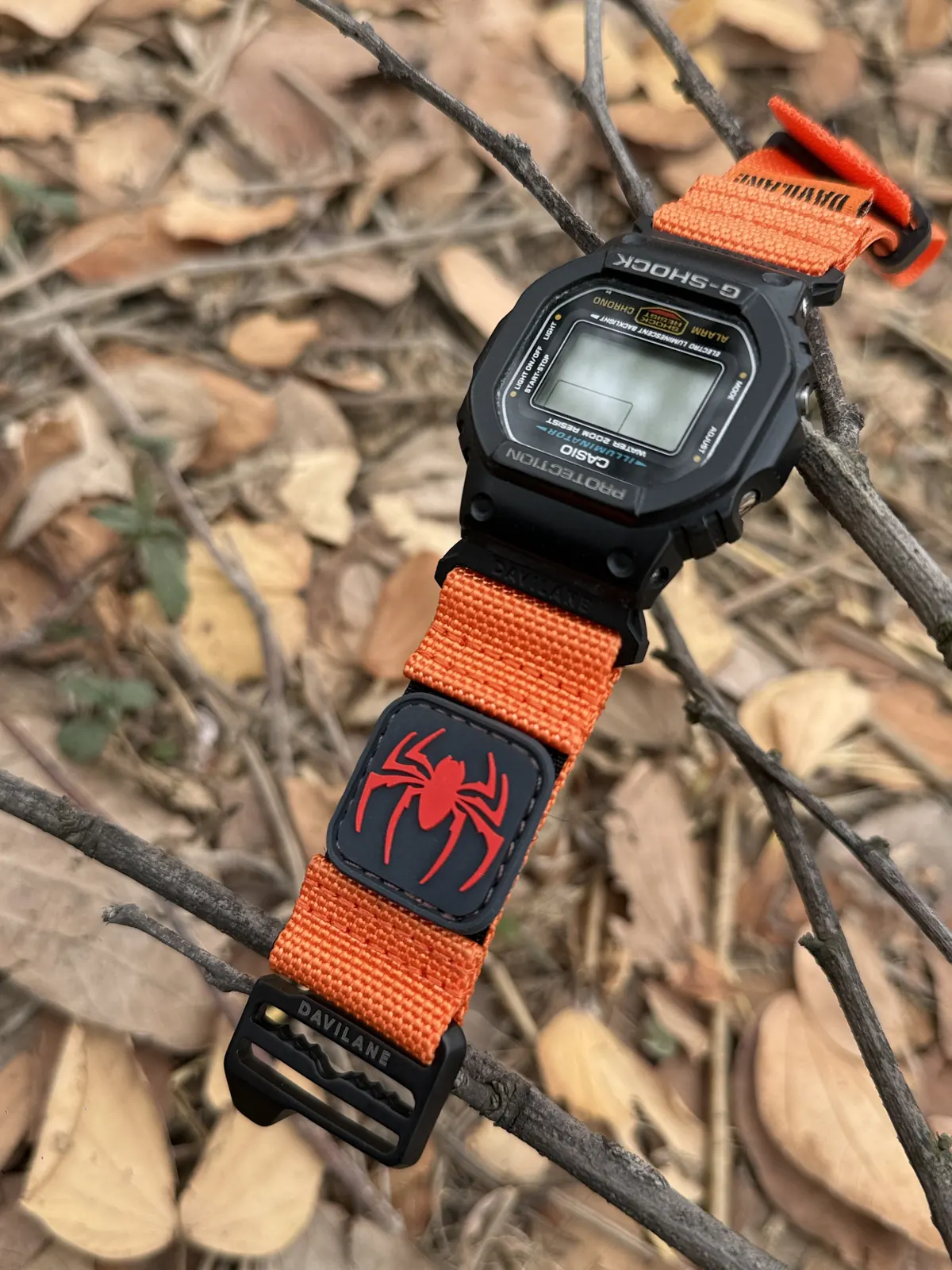 Close view of DAVILANE orange band installed on DW-5600
