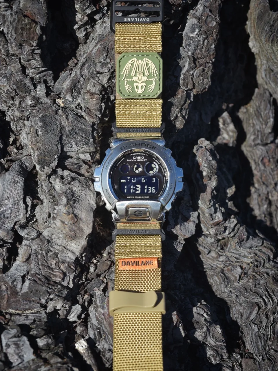 Silver GW-6900 with khaki DAVILANE MOLLE band flat lay